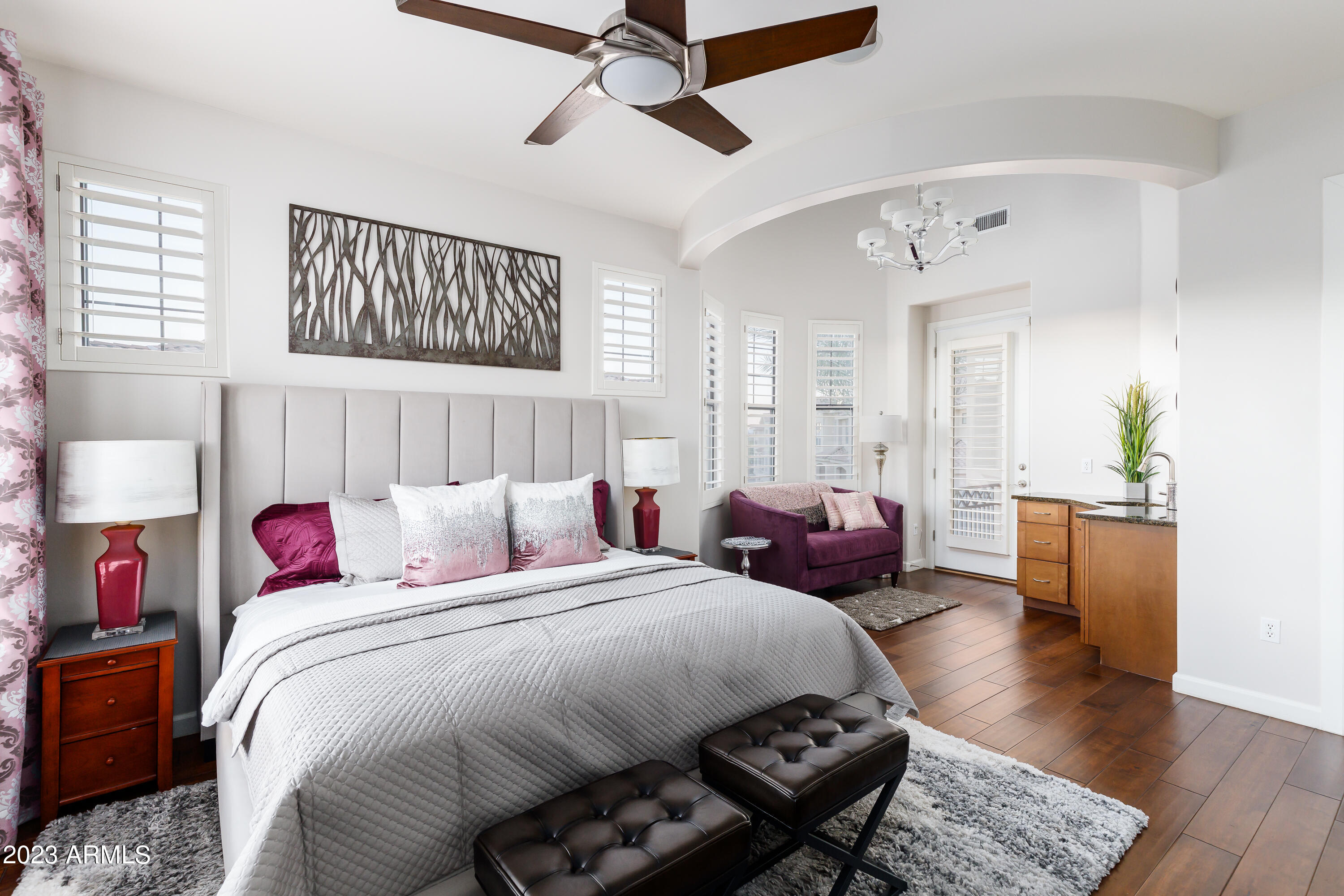 7275 North Scottsdale Road, Unit 1019 Paradise Valley, AZ 85253 - Photo 12 of 28 a bedroom with bed and a chandelier