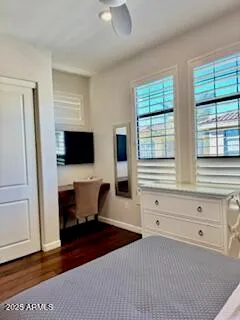a living room with furniture and flat screen tv