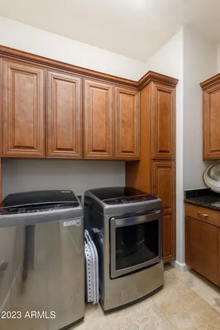 a view of a kitchen with washer and dryer