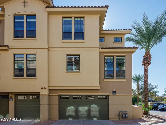 a front view of a house with a garage