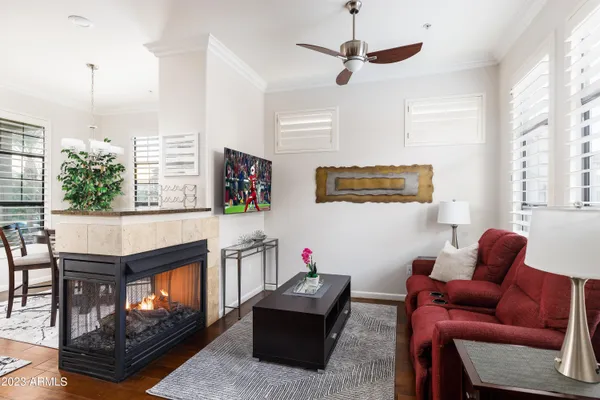 a living room with furniture and a fireplace
