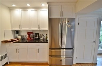 45 Wellesley Road Belmont, MA 02478 - Photo 12 of 39 a kitchen with a refrigerator and cabinets