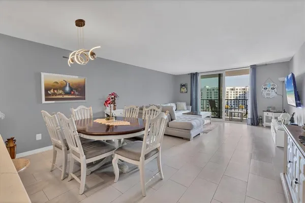 a bedroom with a bed and a view of kitchen