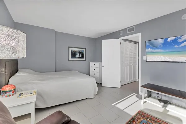 a bedroom with a bed and furniture