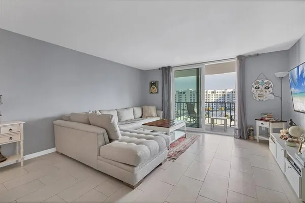 a living room with furniture and a large window