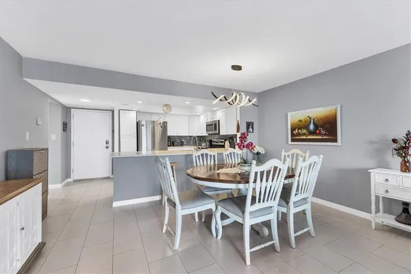 a dining room with furniture and window