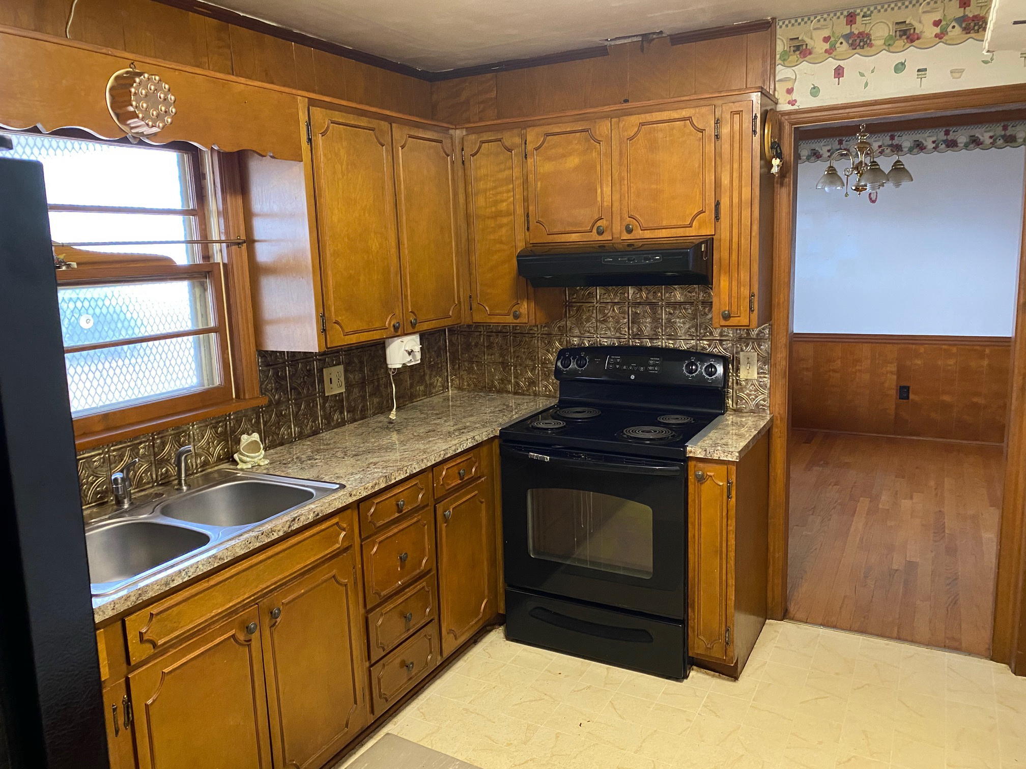 2097 Sandy Level Road Goodview, VA 24095 - Photo 13 of 43 a kitchen with granite countertop a sink and a stove