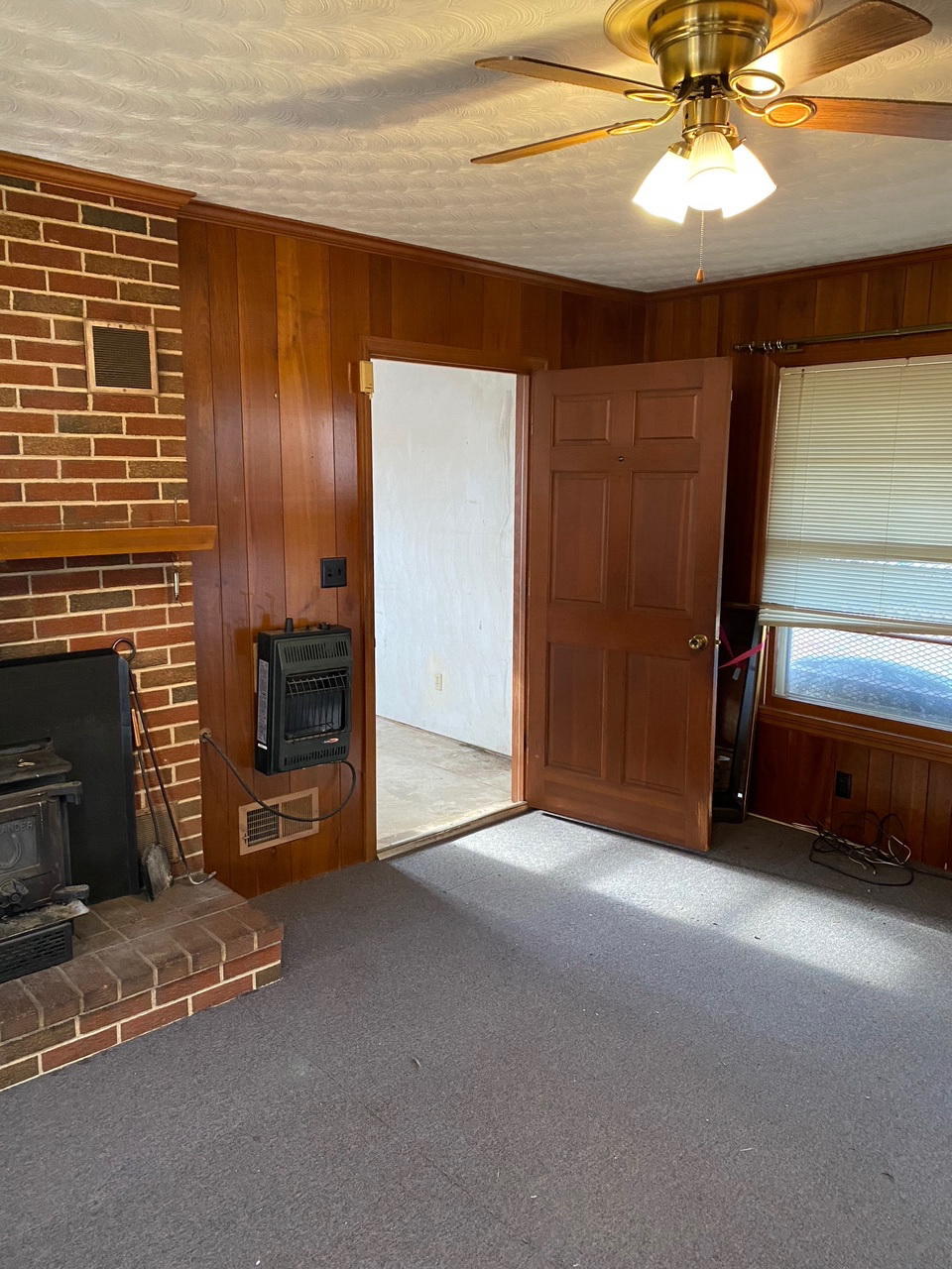 2097 Sandy Level Road Goodview, VA 24095 - Photo 21 of 43 a view of an empty room with a fireplace
