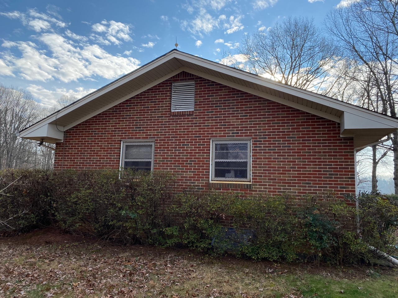 2097 Sandy Level Road Goodview, VA 24095 - Photo 32 of 43 a front view of a house with plants