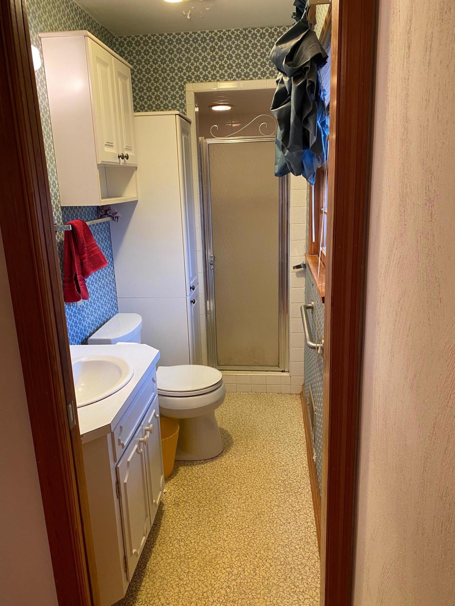 2097 Sandy Level Road Goodview, VA 24095 - Photo 5 of 43 a bathroom with a toilet sink and shower