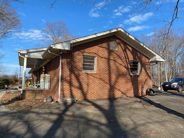 2097 Sandy Level Road Goodview, VA 24095 - Photo 41 of 43 a view of a house with a yard