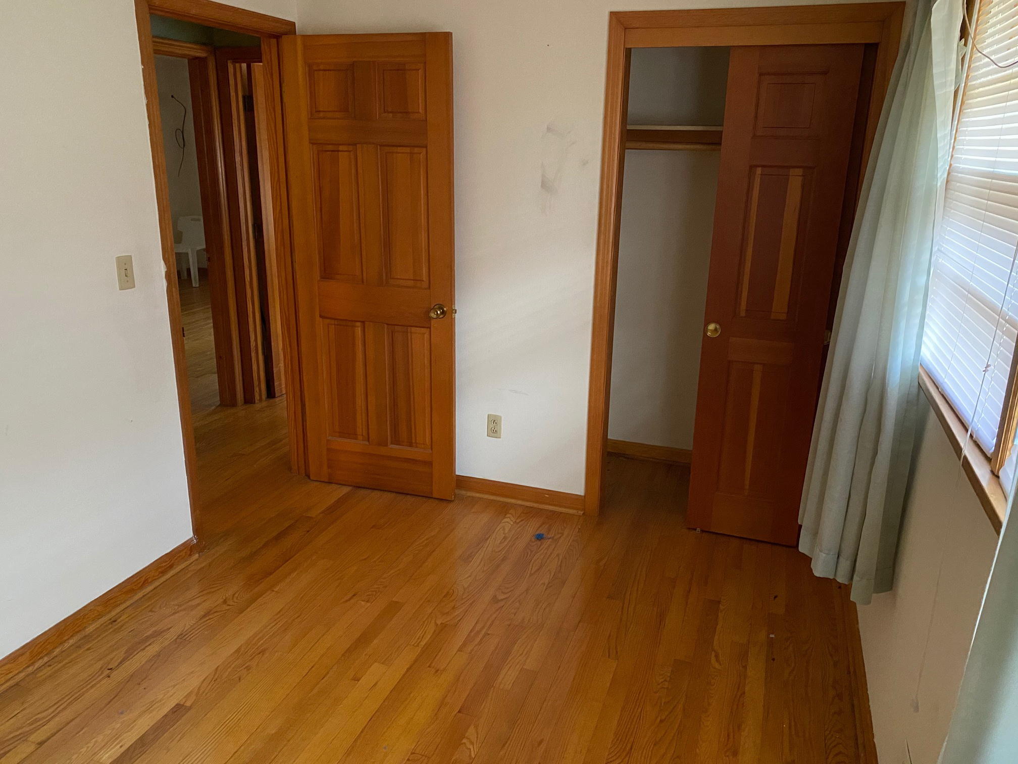 2097 Sandy Level Road Goodview, VA 24095 - Photo 9 of 43 an empty room with wooden floor and windows