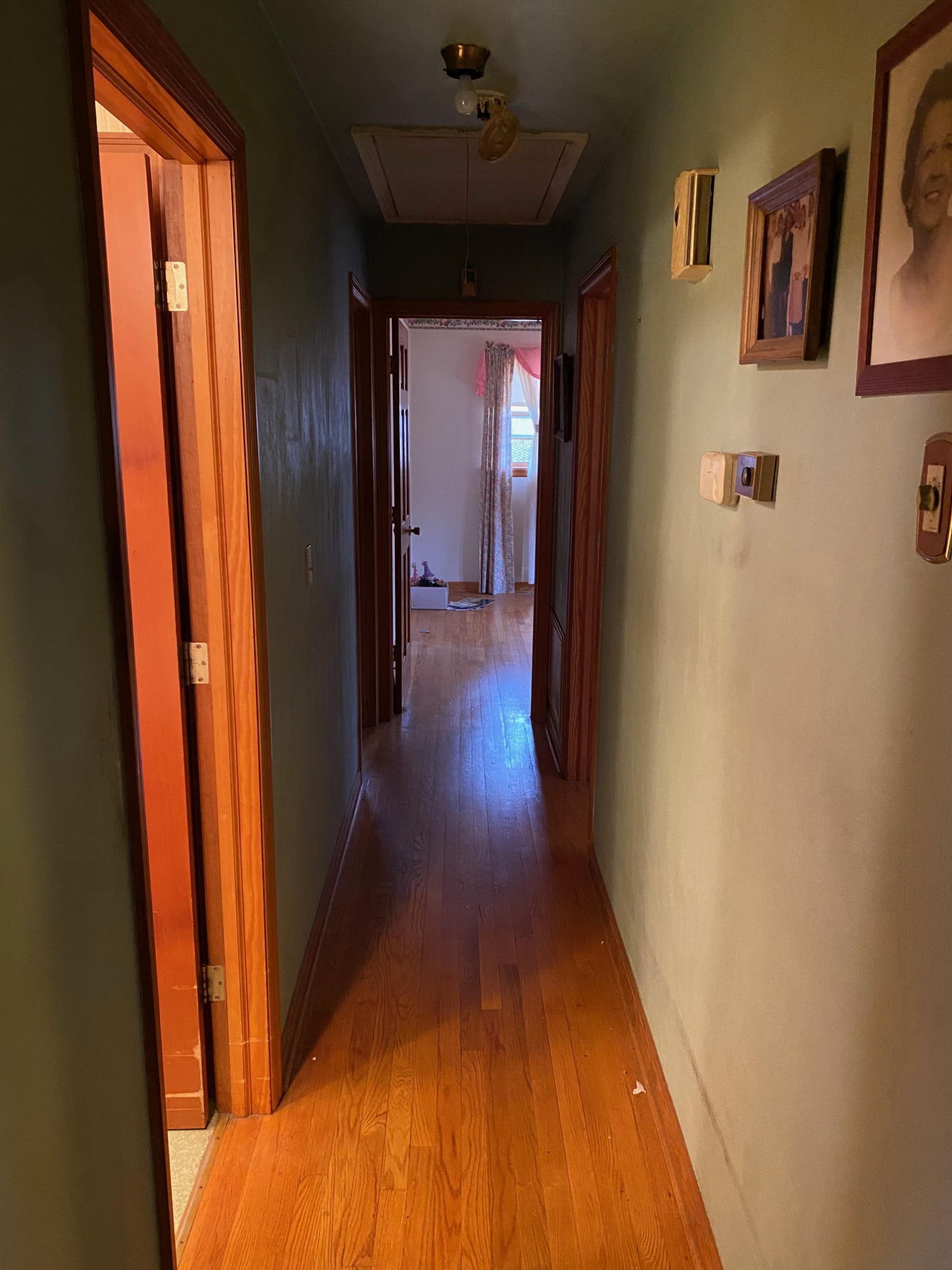 2097 Sandy Level Road Goodview, VA 24095 - Photo 10 of 43 a view of a hallway with wooden floor and stairs