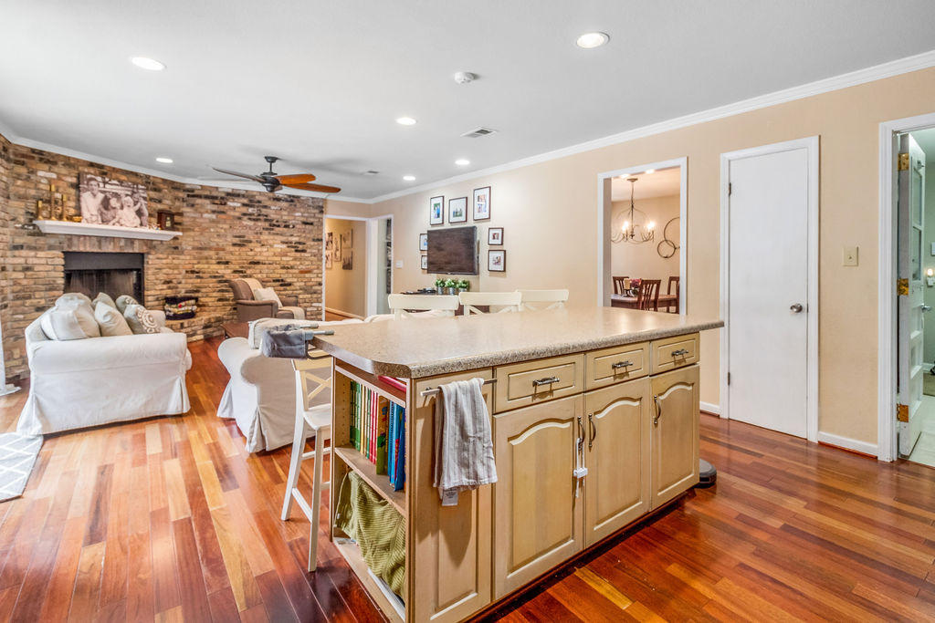 2135 Semur Road Pensacola, FL 32503 - Photo 11 of 37 a view of a kitchen with kitchen island granite countertop a sink and a stove top oven