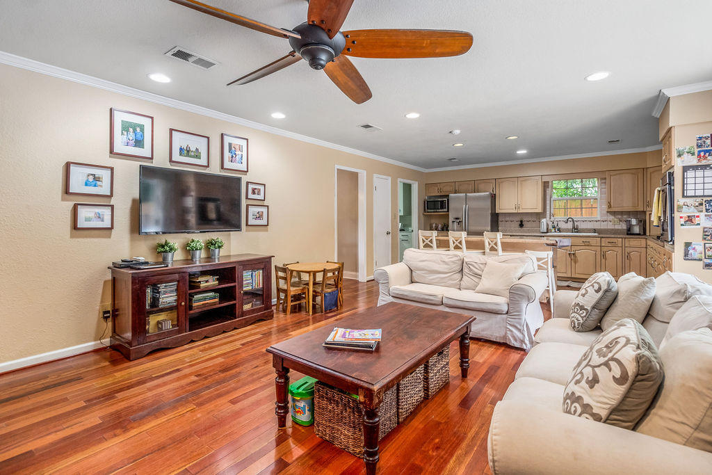 2135 Semur Road Pensacola, FL 32503 - Photo 16 of 37 a living room with furniture a flat screen tv and a dining table