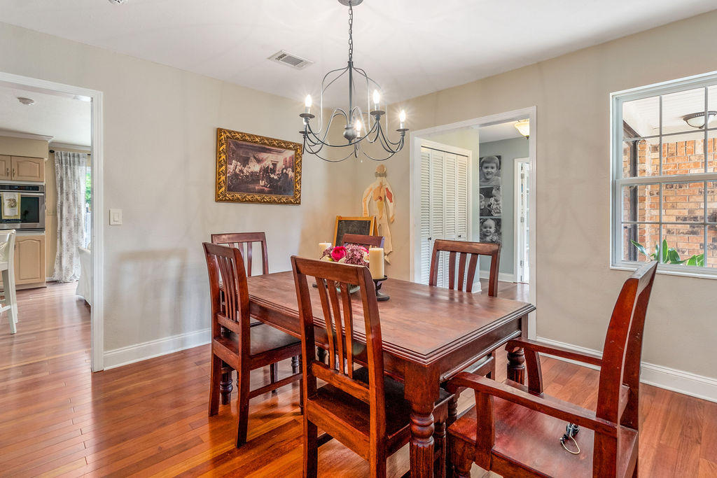 2135 Semur Road Pensacola, FL 32503 - Photo 18 of 37 a view of a dining room with furniture and wooden floor