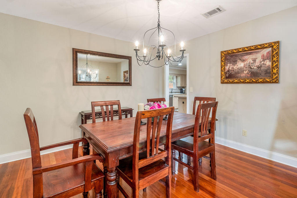 2135 Semur Road Pensacola, FL 32503 - Photo 19 of 37 a view of a dining room with furniture and wooden floor