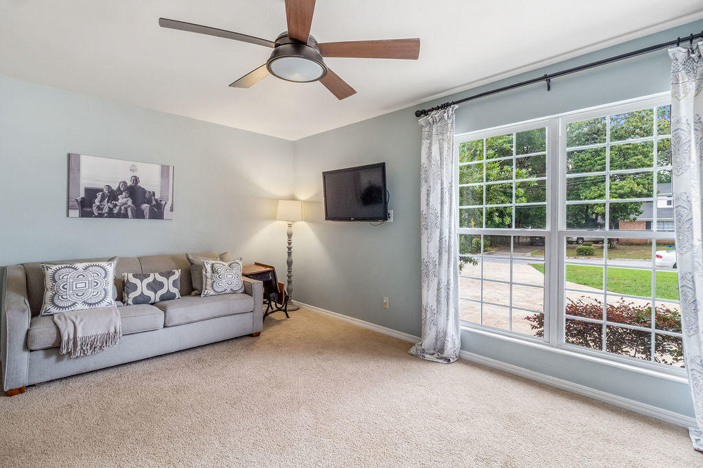 2135 Semur Road Pensacola, FL 32503 - Photo 20 of 37 a living room with furniture a flat screen tv and a large window