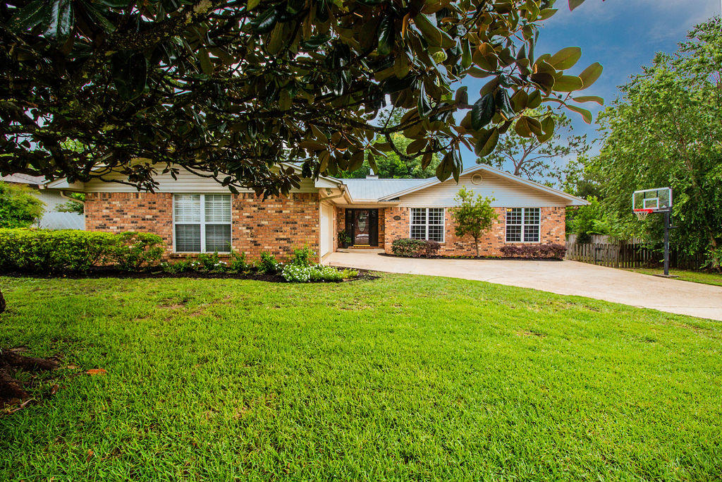 2135 Semur Road Pensacola, FL 32503 - Photo 2 of 37 a front view of house with yard and green space