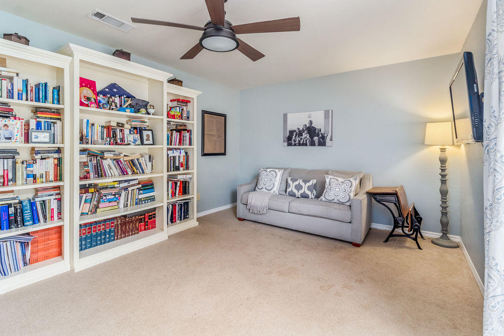 2135 Semur Road Pensacola, FL 32503 - Photo 21 of 37 a living room with lots of books and a book shelf