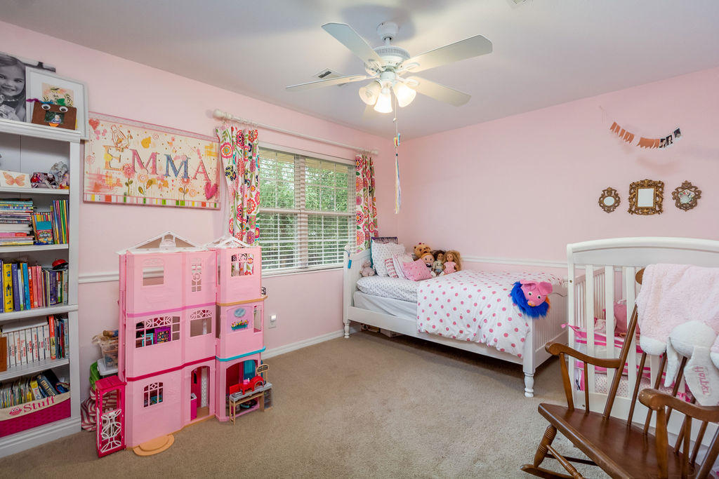 2135 Semur Road Pensacola, FL 32503 - Photo 28 of 37 a bedroom with furniture and a book shelf