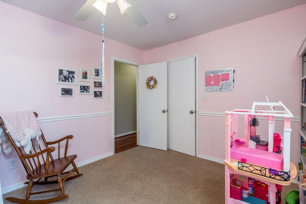 2135 Semur Road Pensacola, FL 32503 - Photo 29 of 37 a bedroom with furniture and a chandelier fan