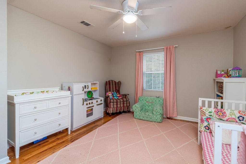 2135 Semur Road Pensacola, FL 32503 - Photo 30 of 37 a room with a baby crib dresser and a window