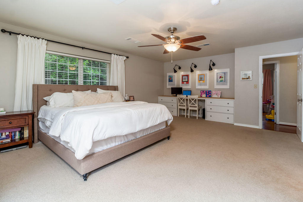 2135 Semur Road Pensacola, FL 32503 - Photo 32 of 37 a bedroom with a bed and a chandelier