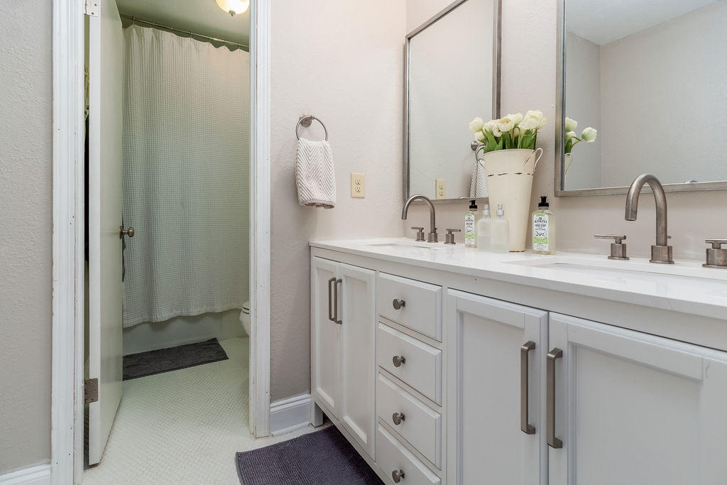 2135 Semur Road Pensacola, FL 32503 - Photo 35 of 37 a bathroom with a double vanity sink and mirror
