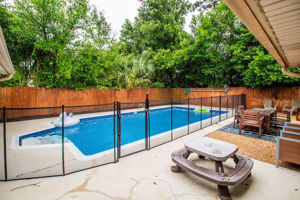 2135 Semur Road Pensacola, FL 32503 - Photo 5 of 37 a view of a swimming pool with a lounge chairs