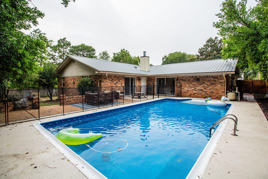 2135 Semur Road Pensacola, FL 32503 - Photo 6 of 37 swimming pool view with a seating space