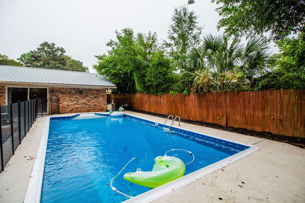 2135 Semur Road Pensacola, FL 32503 - Photo 7 of 37 swimming pool view with a seating space