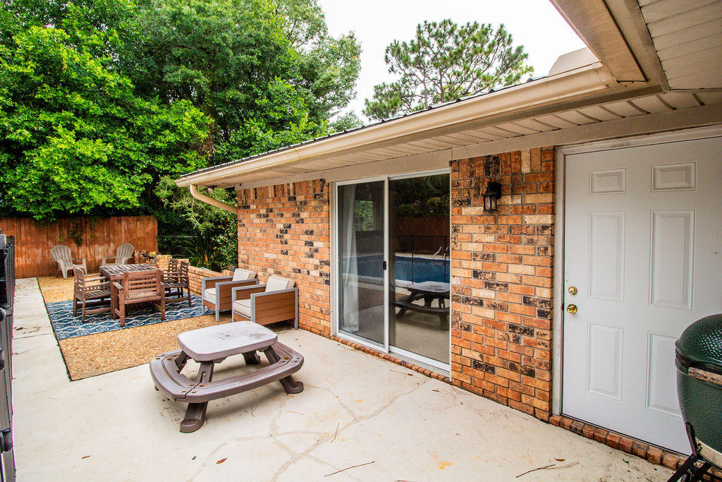 2135 Semur Road Pensacola, FL 32503 - Photo 8 of 37 a backyard of a house with fire pit and outdoor seating