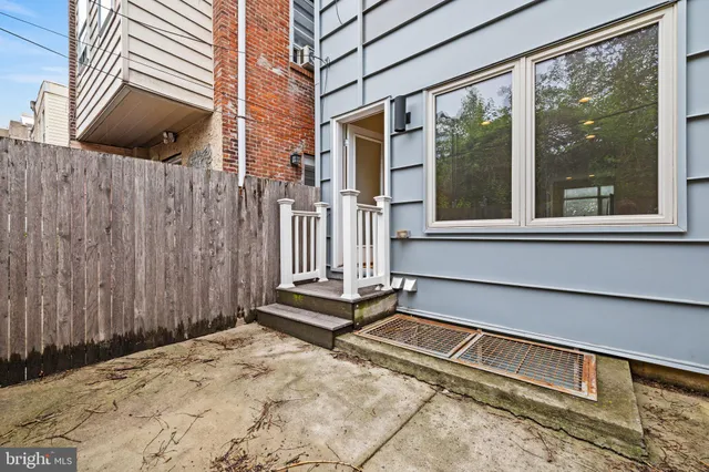 a house with a bench in front of it