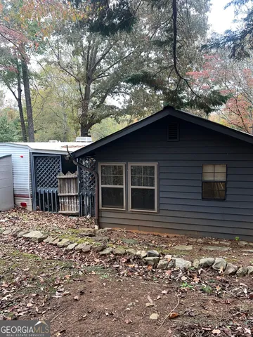 a house with trees in the background