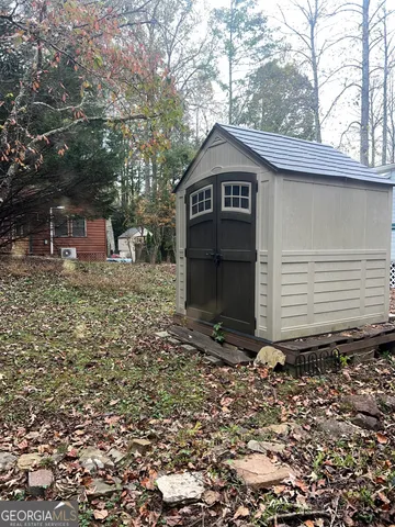 a house with trees in the background