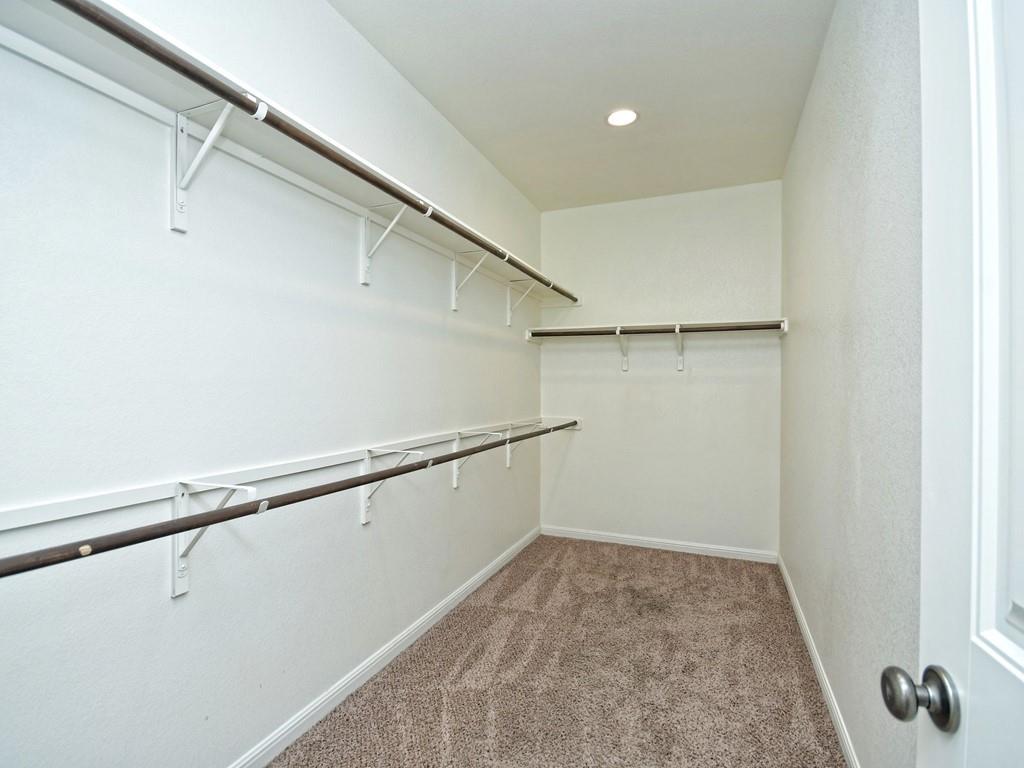 2216 Lookout Range Drive Leander, TX 78641 - Photo 11 of 16 Walk in closet featuring light colored carpet