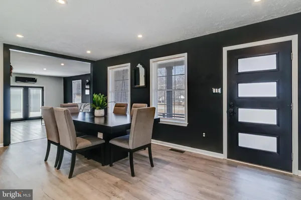 a dining room with furniture and window
