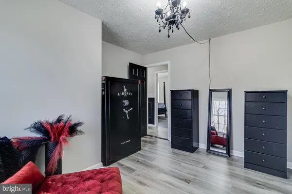 a view of a bedroom with a furniture and closet