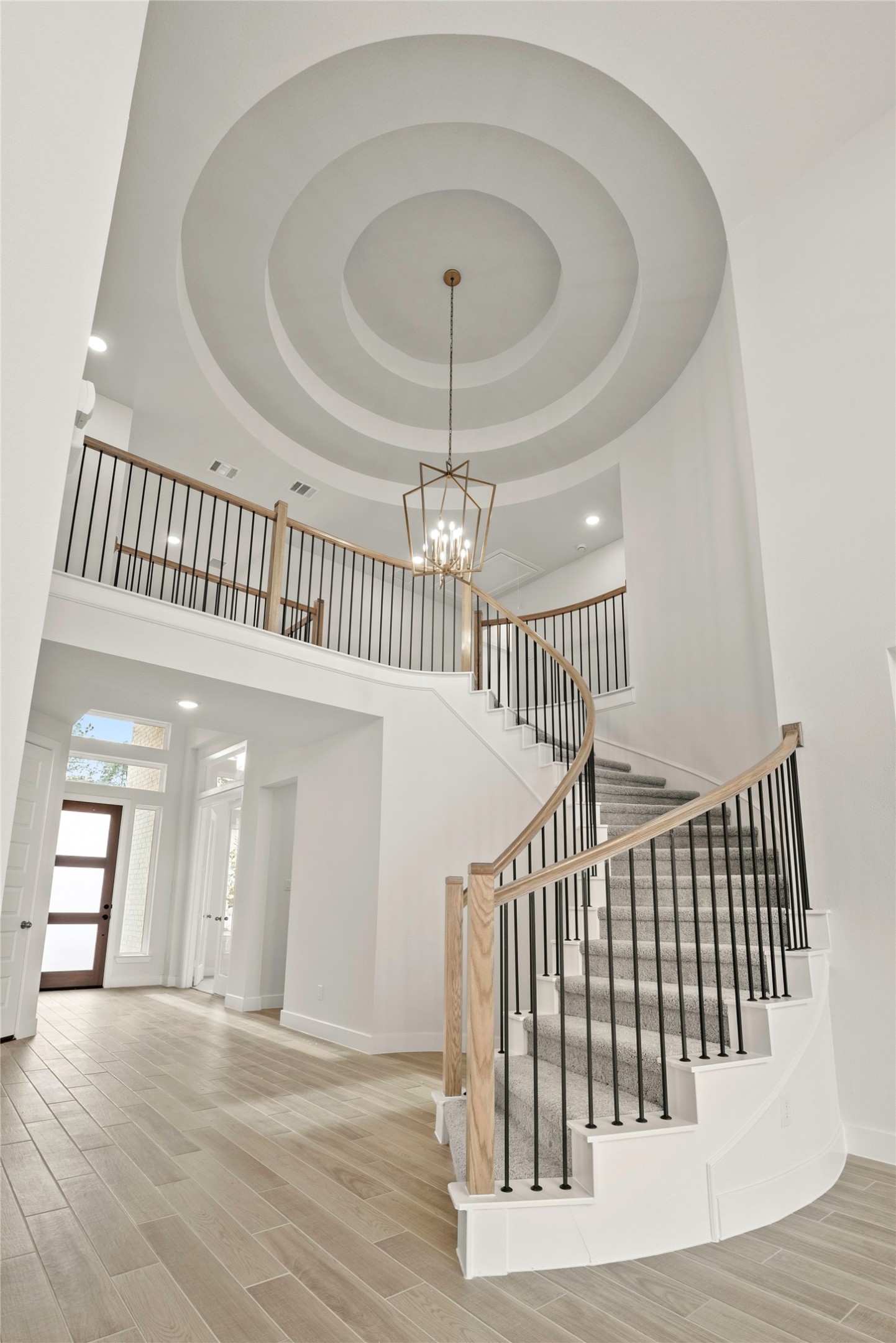 18917 Moonriver Street Conroe, TX 77302 - Photo 2 of 28 a view of livingroom with stairs and front door