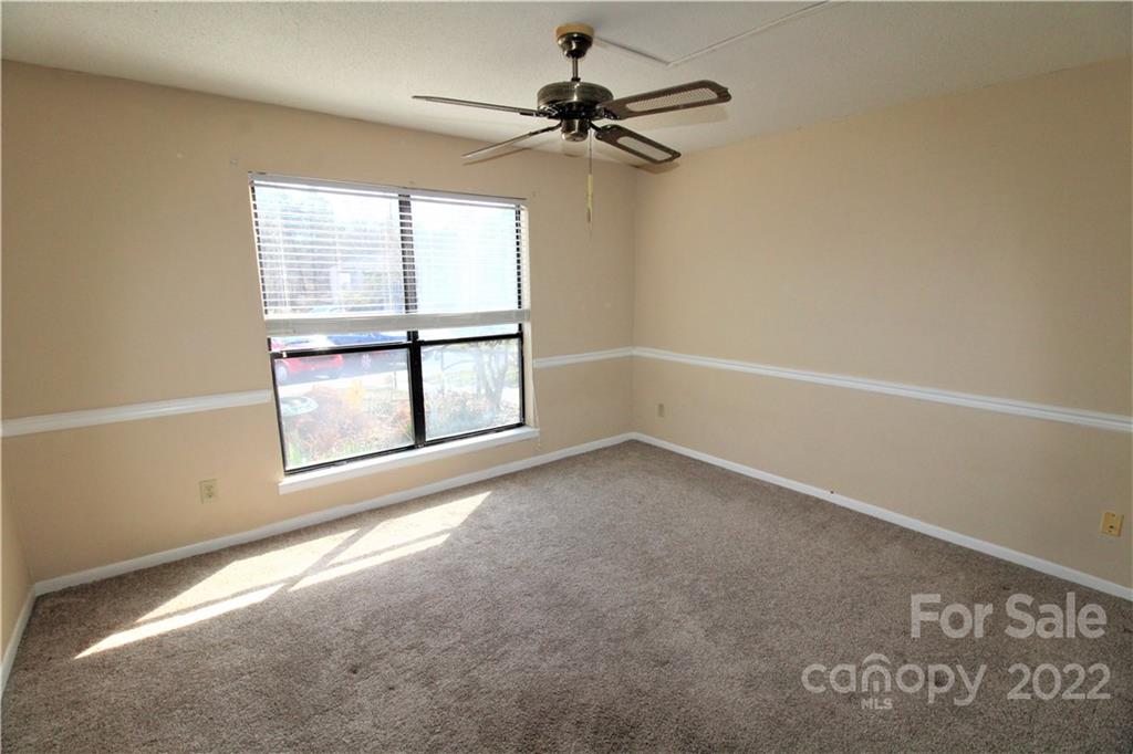 11072 Cedar View Road Charlotte, NC 28226 - Photo 14 of 18 an empty room with a window