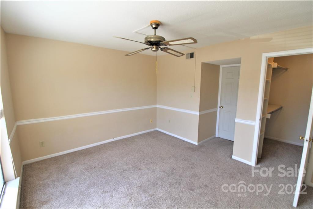11072 Cedar View Road Charlotte, NC 28226 - Photo 15 of 18 a view of a livingroom with a ceiling fan and hardwood floor