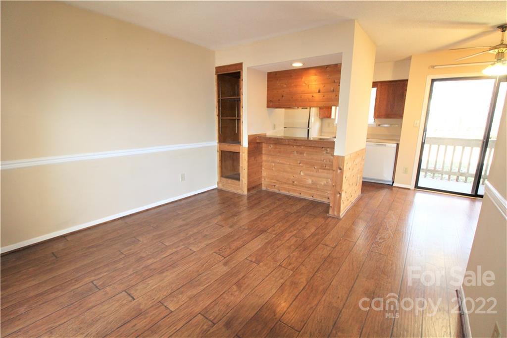 11072 Cedar View Road Charlotte, NC 28226 - Photo 3 of 18 an empty room with wooden floor and windows