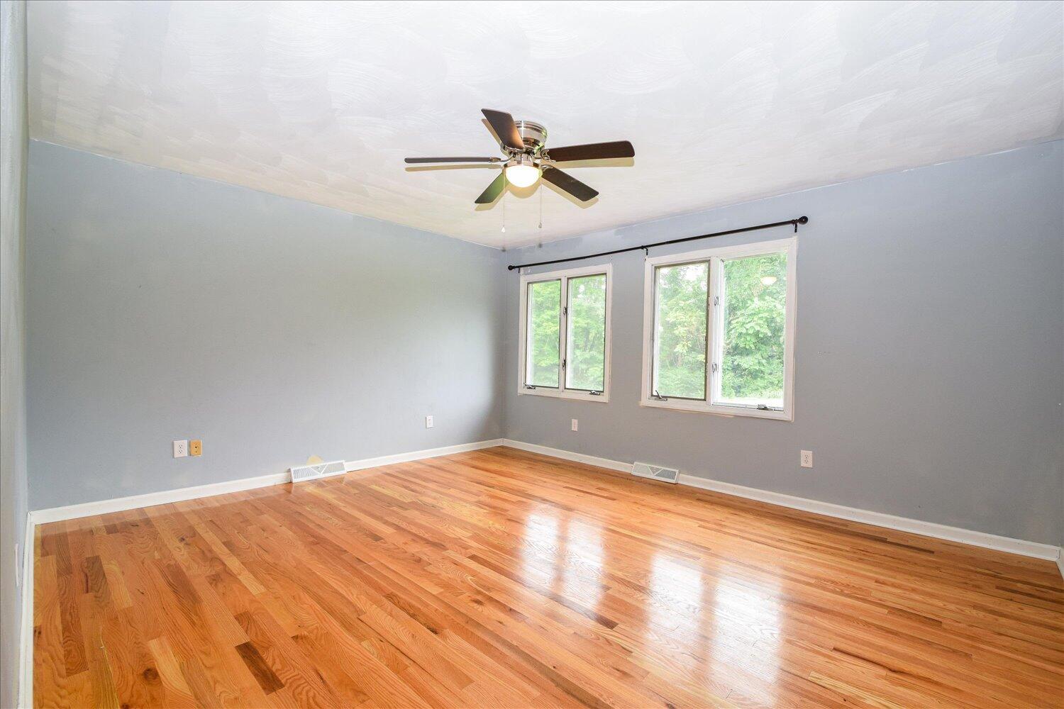 1316 Dudley Road Moneta, VA 24121 - Photo 20 of 37 a view of empty room with wooden floor and fan