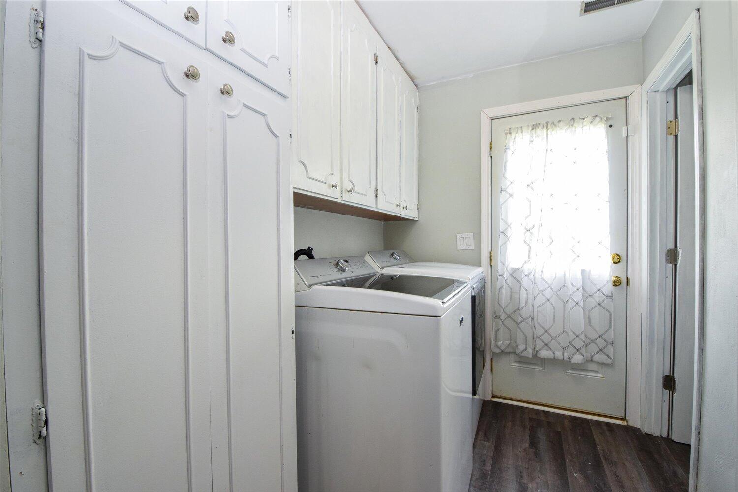1316 Dudley Road Moneta, VA 24121 - Photo 26 of 37 a utility room with cabinets washer and dryer