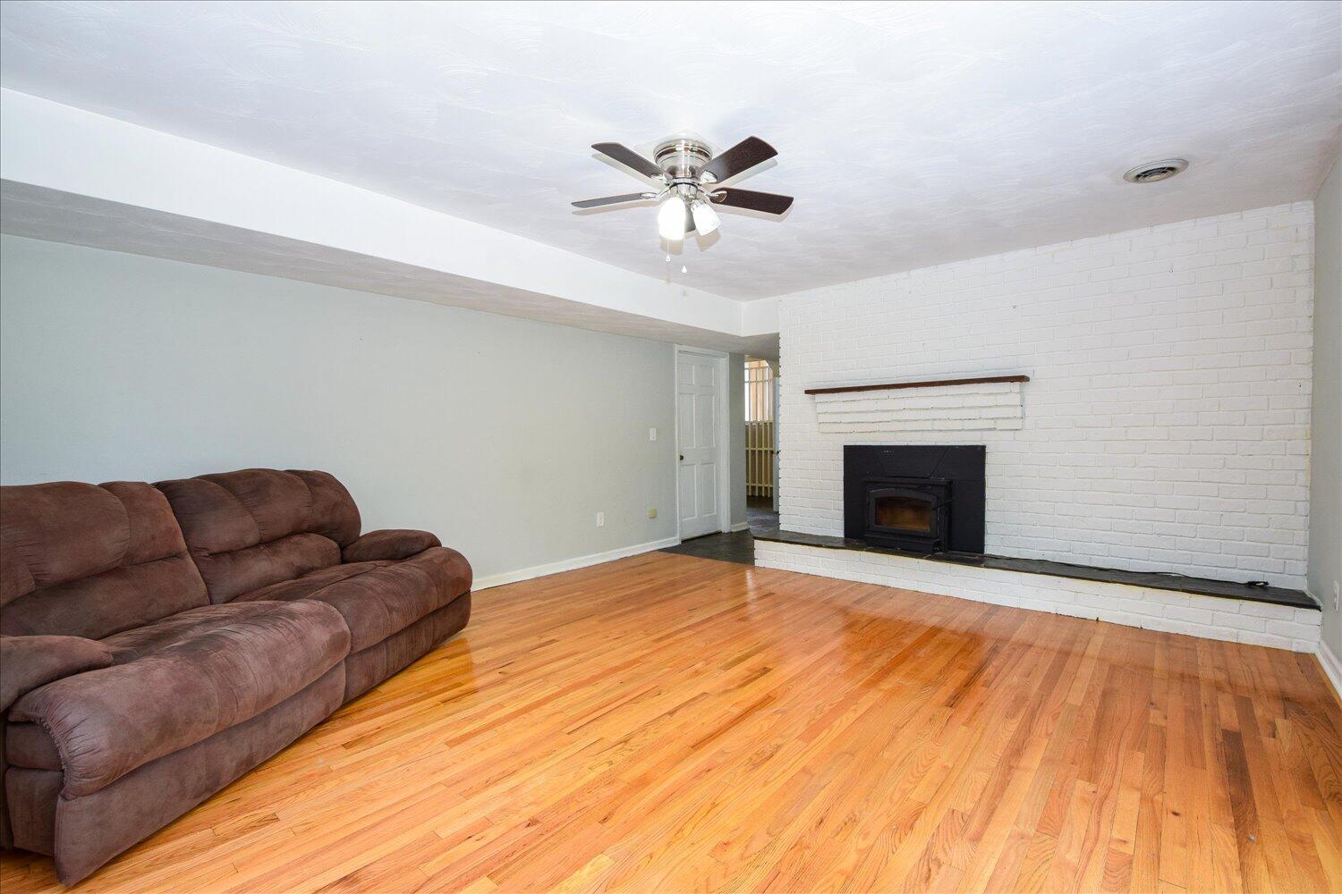 1316 Dudley Road Moneta, VA 24121 - Photo 8 of 37 a living room with furniture and a fireplace