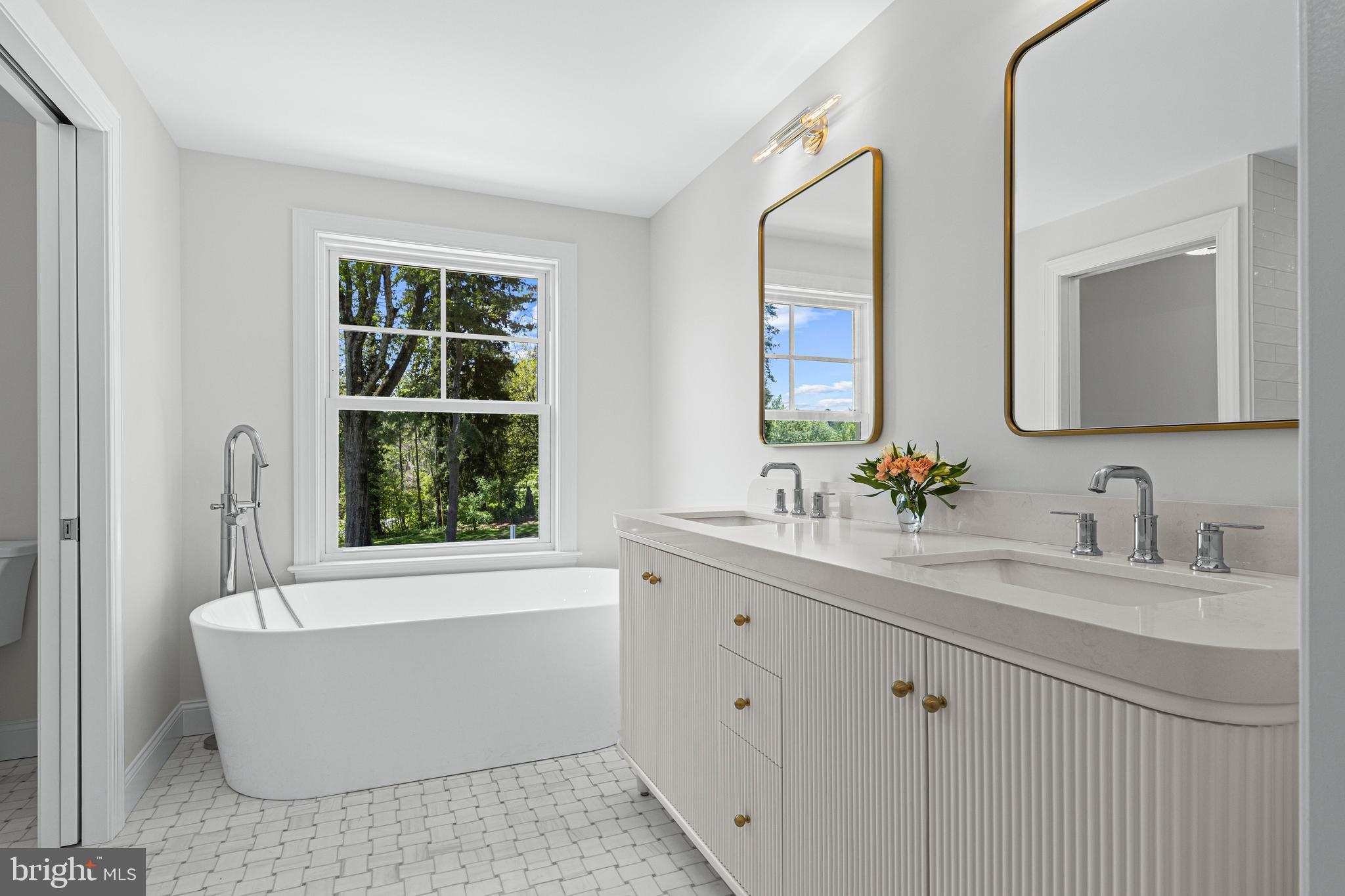 1611 Lark Lane Villanova, PA 19085 - Photo 38 of 67 Primary ensuite bath with marble flooring, tub