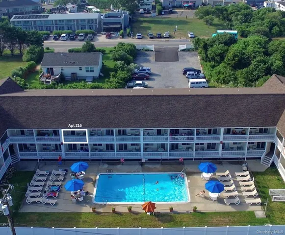 an aerial view of a house with garden space and sitting area