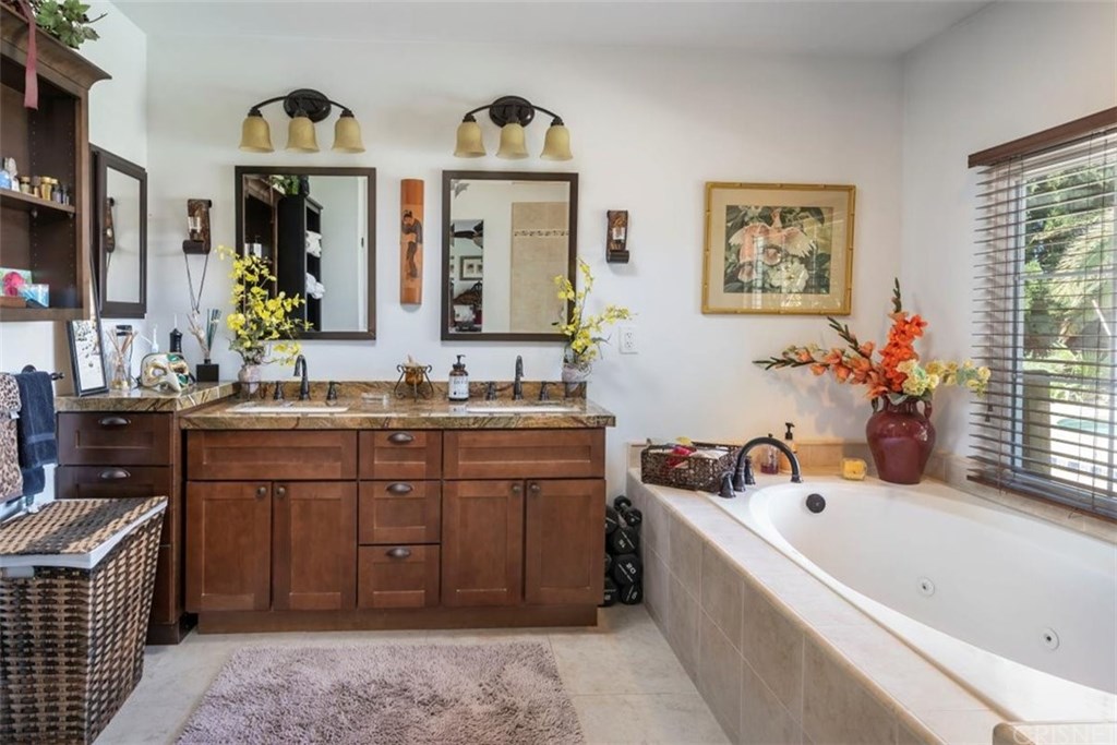 19701 Green Mountain Drive Newhall, CA 91321 - Photo 28 of 37 Expanded main bathroom with double sinks, large tub and stand-up shower!