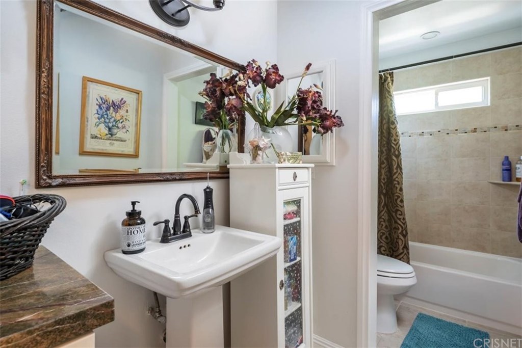 19701 Green Mountain Drive Newhall, CA 91321 - Photo 34 of 37 Secondary bathroom with separate dual shower/tub and toilet area.